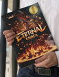 Person holding a book titled 'Eternal Ember' with a fiery design on the cover by Ricardo Stevens Concert Band Music.